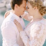 groom-hugs-bride-by-the-sea-portrait.jpg