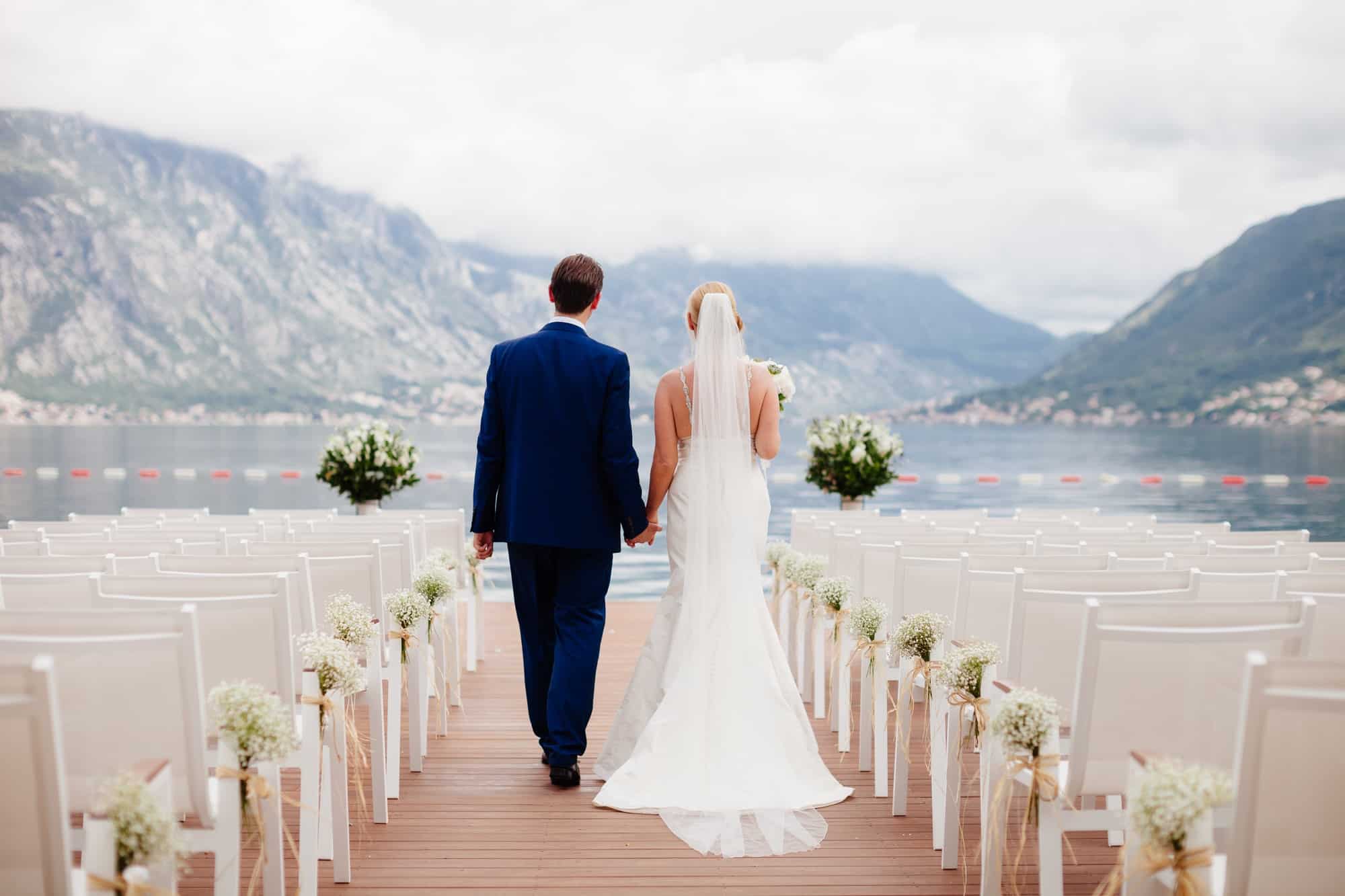 wedding-couple-at-wedding-ceremony-back-view.jpg