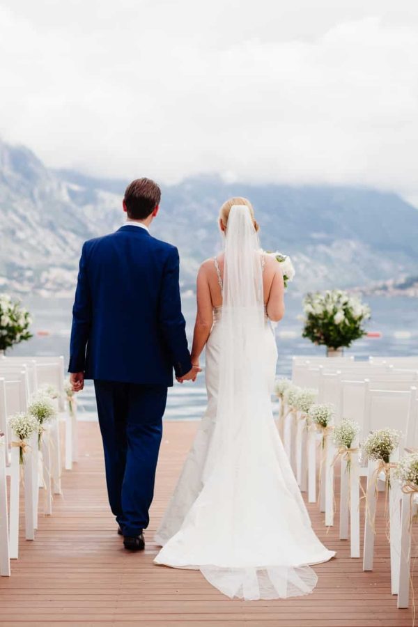 wedding-couple-at-wedding-ceremony-back-view.jpg